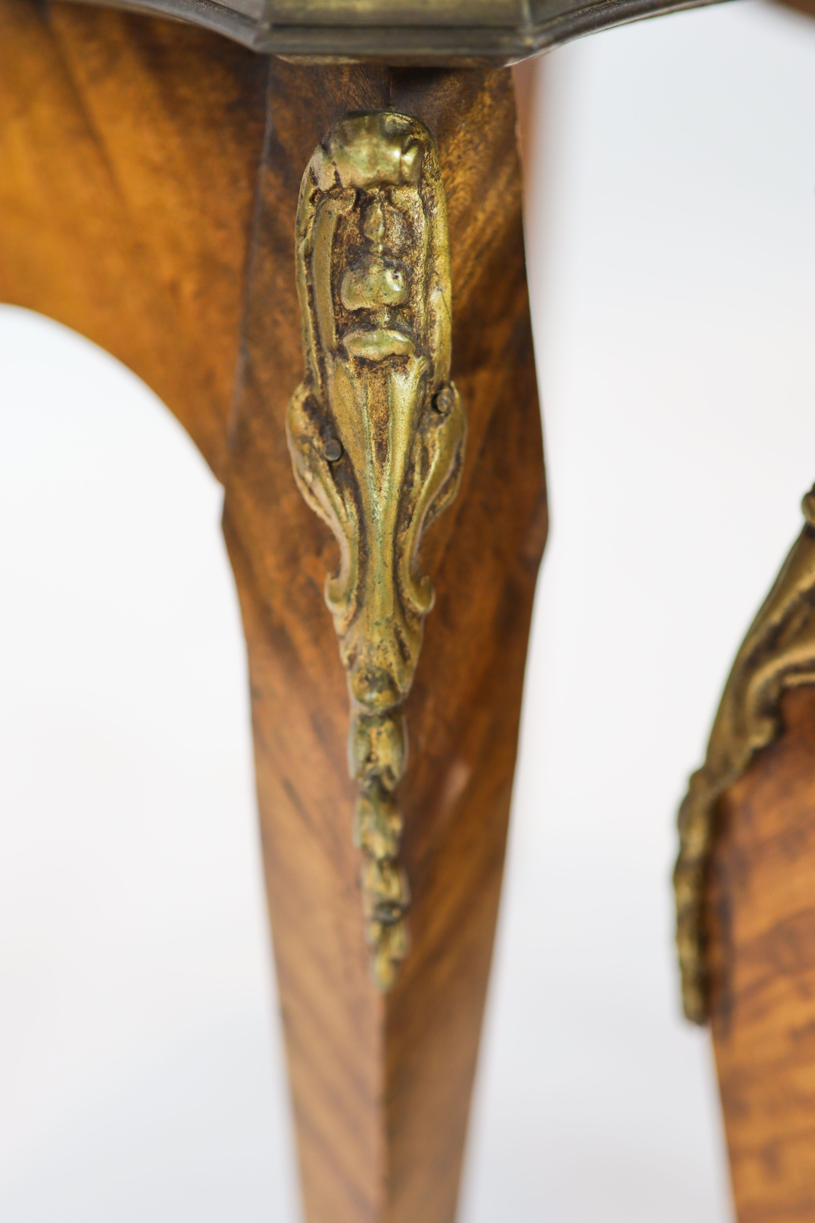 A nest of three Louis XV style ormolu mounted banded kingwood tables, with serpentine sides, on cabriole legs, width 51cm, depth 41cm, height 59cm